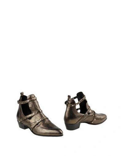 Shop Jimmy Choo Ankle Boots In Gold