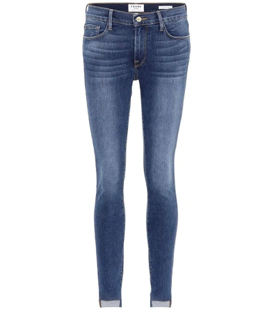 Shop Frame Le High Skinny Step Hem Jeans In Blue