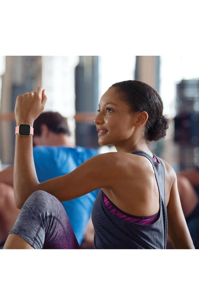 Shop Fitbit Versa Smart Watch In Peach / Rose Gold