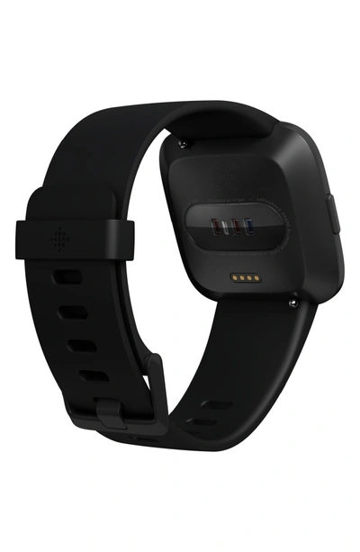 Shop Fitbit Versa Smart Watch In Black / Black