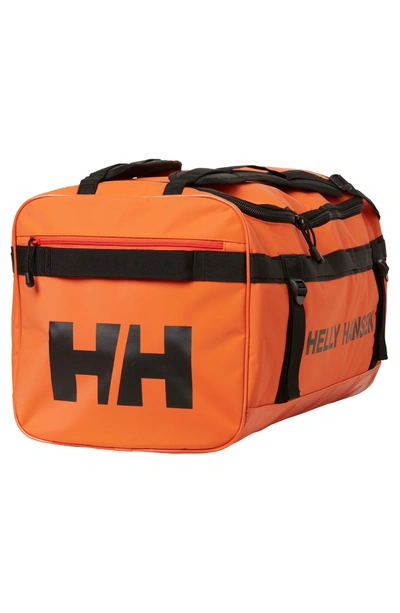 Shop Helly Hansen New Classic Large Duffel Bag - Orange In Spray Orange