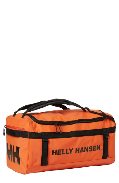 Shop Helly Hansen New Classic Medium Duffel Bag - Orange In Spray Orange