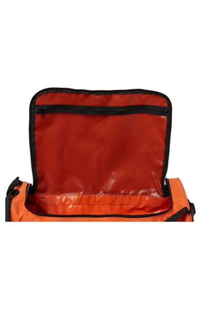 Shop Helly Hansen New Classic Medium Duffel Bag - Orange In Spray Orange