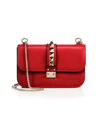 Shop Valentino Garavani Medium Rocklock Leather Crossbody Bag In Red