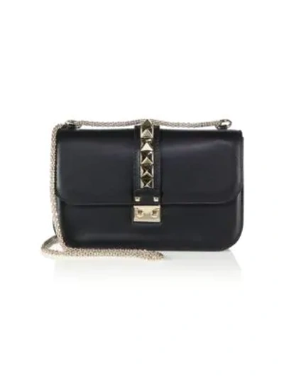 Shop Valentino Medium Rocklock Leather Crossbody Bag In Black