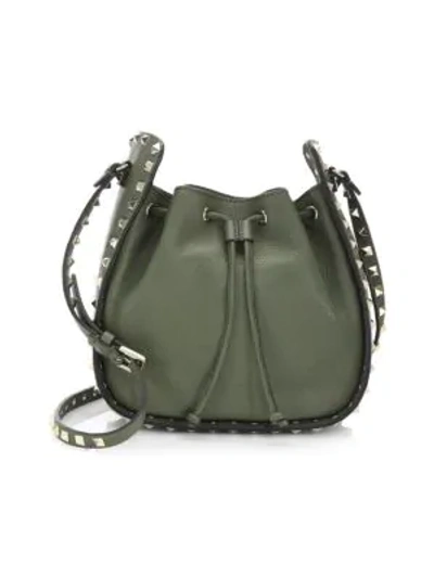 Shop Valentino Rockstud Leather Bucket Bag In Army Green