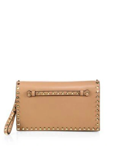 Shop Valentino Rockstud Flap Clutch In Taupe