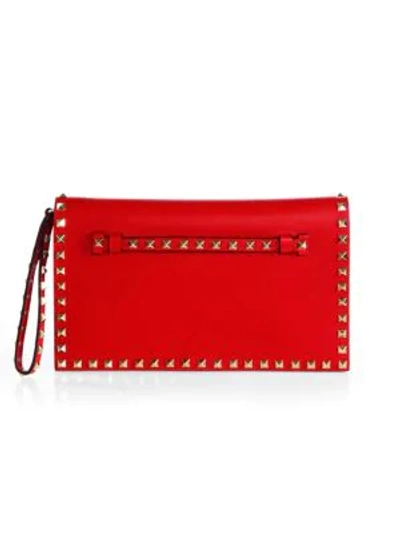 Shop Valentino Garavani Rockstud Leather Clutch In Red