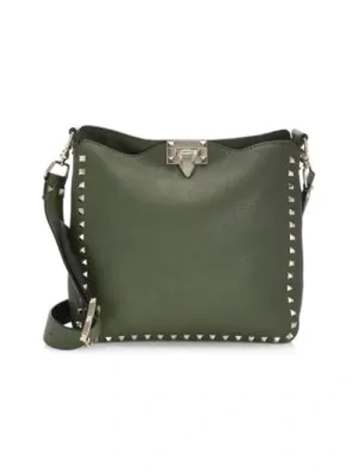 Shop Valentino Rockstud Utilitarian Hobo Bag In Army Green