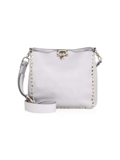 Shop Valentino Rockstud Small Leather Hobo Bag In Pastel Grey