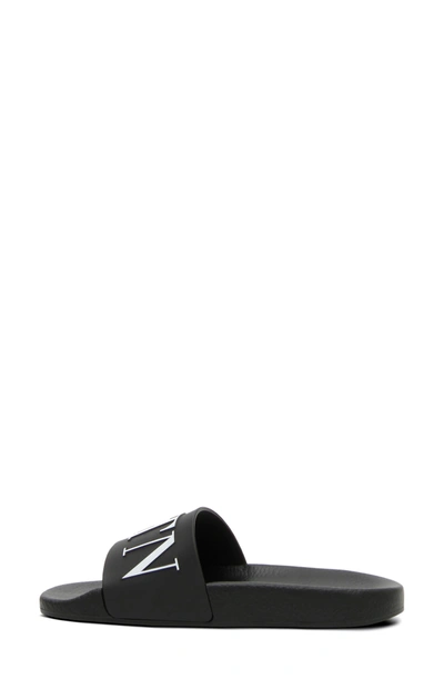 Shop Valentino Vltn Pool Slide Sandal In Black/ White