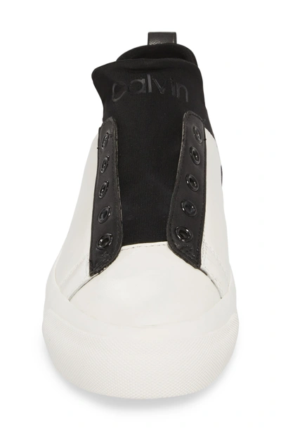 Shop Calvin Klein Valorie Mid Top Sneaker In White/ Black Leather