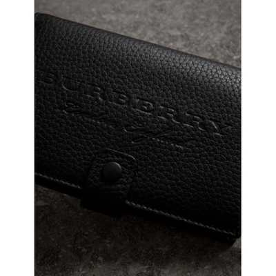 Shop Burberry Embossed Grainy Leather Folding Wallet In Black