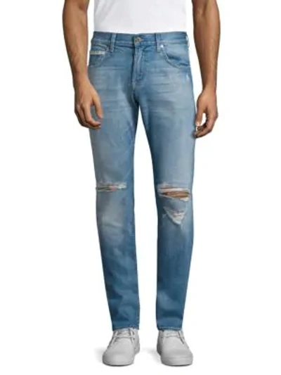 Shop 7 For All Mankind Paxtyn Skinny Tapered Distressed Jeans In Outlaw
