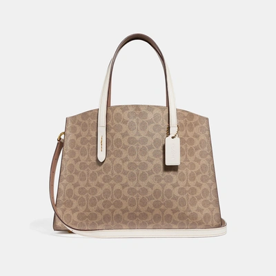 Shop Coach Charlie Carryall In Signature Canvas In Chalk/brass