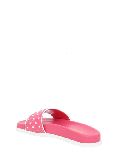 Shop Valentino Free Rockstud Spike Slides In Pink