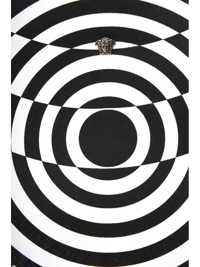 Shop Versace Optillusion White &amp; Black Leather Clutch In White/black
