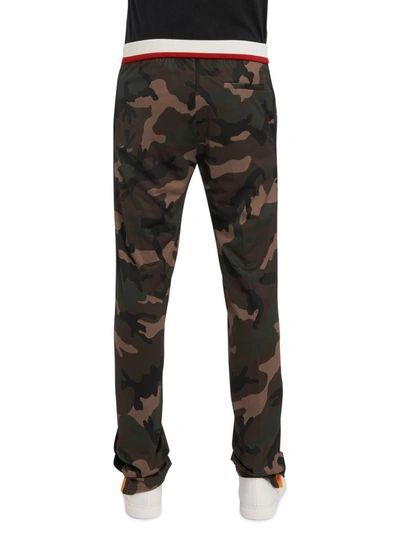 Shop Valentino Camouflage Trousers In Green