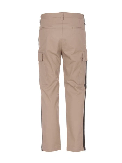 Shop Msgm Striped-detail Trousers In Beige