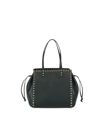 Shop Valentino Rockstud Hand Bag In Black