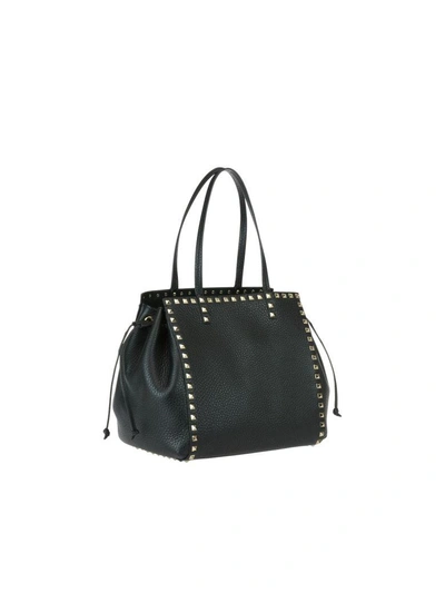 Shop Valentino Rockstud Hand Bag In Black