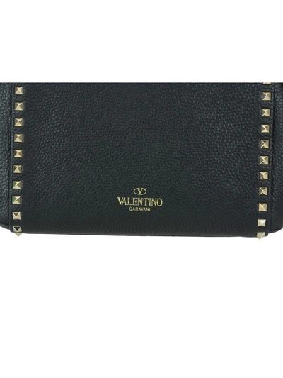 Shop Valentino Rockstud Hand Bag In Black