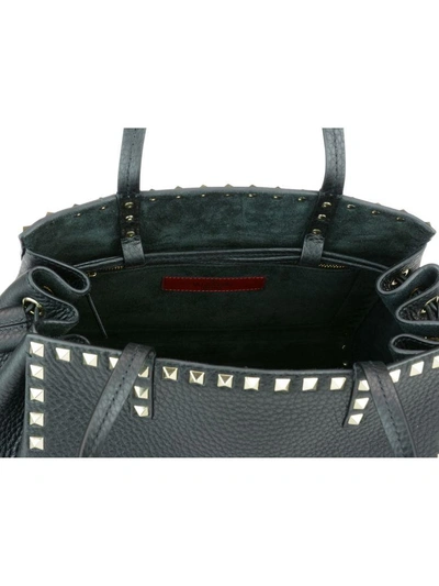 Shop Valentino Rockstud Hand Bag In Black