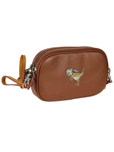 Shop Coach Dinosaur Shoulder Bag In Brown