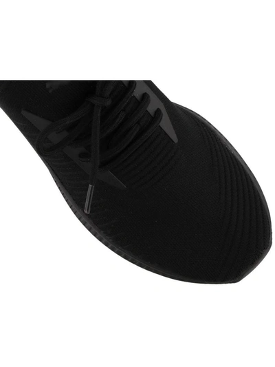 Shop Puma Avid Evoknit Sneakers In Black