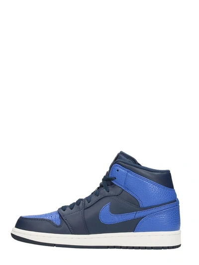 Shop Nike Air Jordan 1 Mid Blue Leather Sneakers