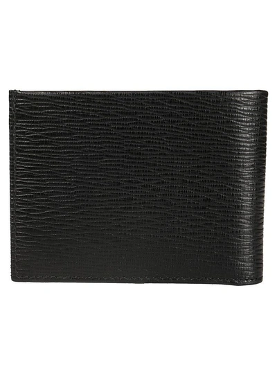 Shop Ferragamo Gold-tone Logo Wallet In Black