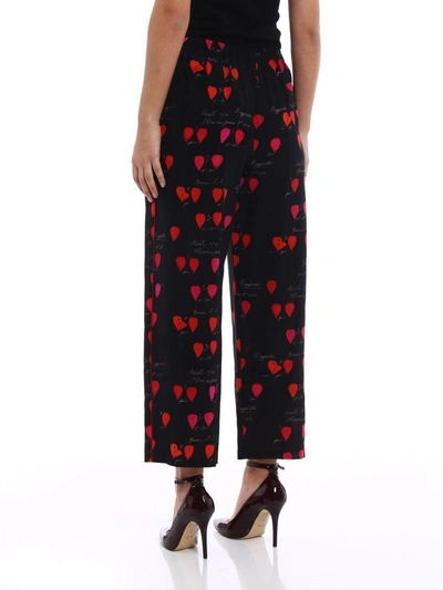 Shop Alexander Mcqueen Petal Print Trousers In Black Red Lipstick