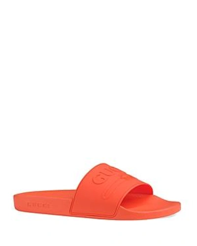 Shop Gucci Men's Embossed Logo Slide Sandals In Orange