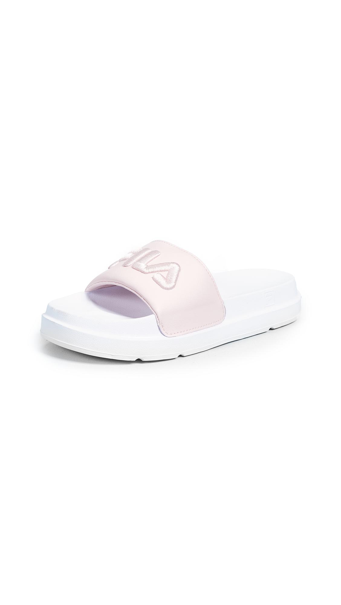 black and pink fila slides