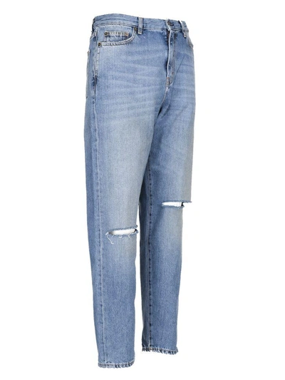 Shop Saint Laurent Ripped Jeans In 4061