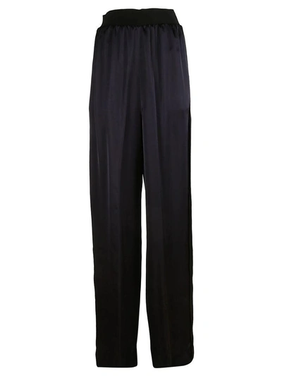 Shop Maison Margiela Flared High Waisted Trousers