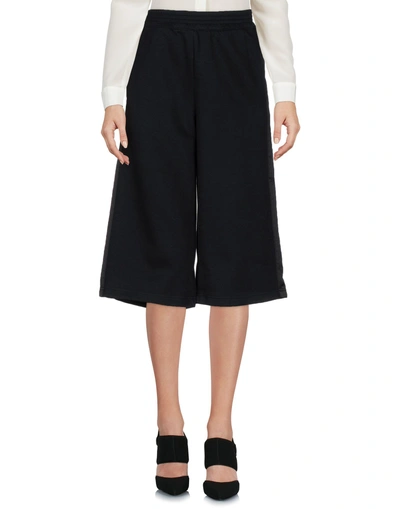Shop Puma 3/4-length Shorts In Black