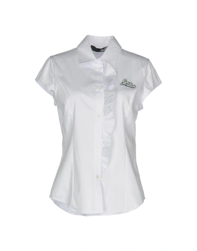 Shop Love Moschino Solid Color Shirts & Blouses In White