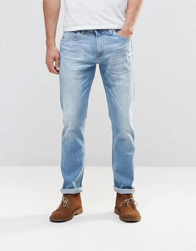 Shop Wrangler Bostin Slim Jeans Sandstorm Light Distressed Wash - Blue