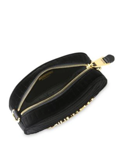 Shop Moschino Goldtone Logo Belt Bag In Black