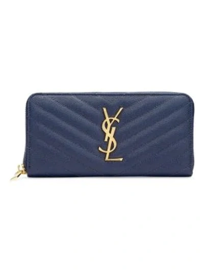 Shop Saint Laurent Monogram Matelassé Leather Zip-around Wallet In Navy