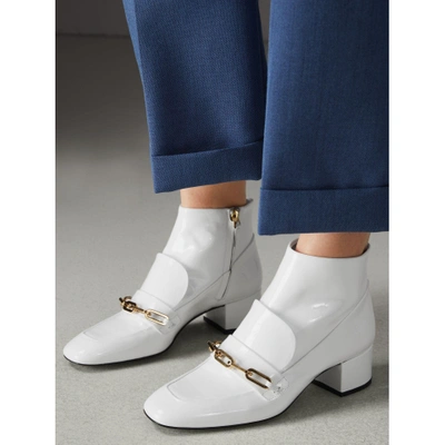 Shop Burberry Link Detail Patent Leather Ankle Boots In Optic White