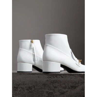 Shop Burberry Link Detail Patent Leather Ankle Boots In Optic White