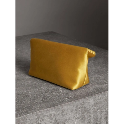 Shop Burberry The Small Pin Clutch In Satin In Amber Yellow