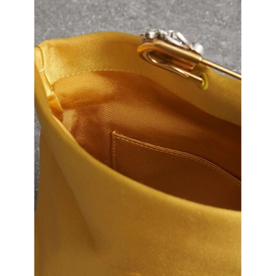 Shop Burberry The Small Pin Clutch In Satin In Amber Yellow
