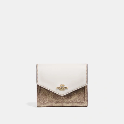 Shop Coach Small Wallet In Colorblock Signature Canvas In B4/tan Chalk