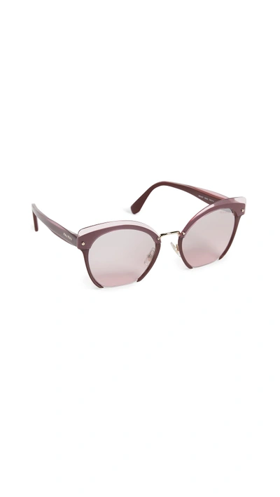 Shop Miu Miu Cut Frame Mirrored Sunglasses In Garnet/pink Silver