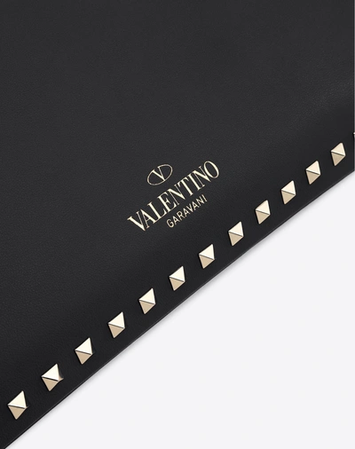 Shop Valentino Rockstud Clutch In Black