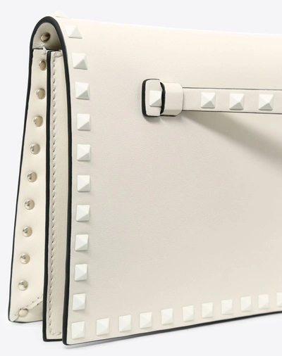 Shop Valentino Lacquer Rockstud Wristlet Clutch In Light Ivory