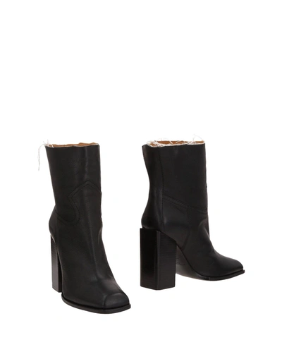 Shop Saint Laurent Ankle Boots In Black